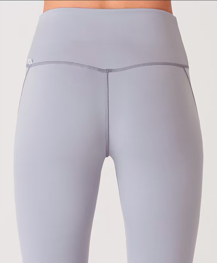 Full-length stretch jogging pants calf hem cutting view, private label women’s workout bottoms