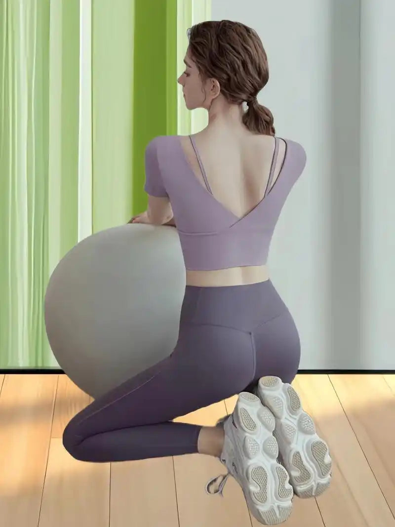 High-rise stretch training leggings paired with cropped short sleeve top rear kneeling pose, ODM private label women athletic coord apparel