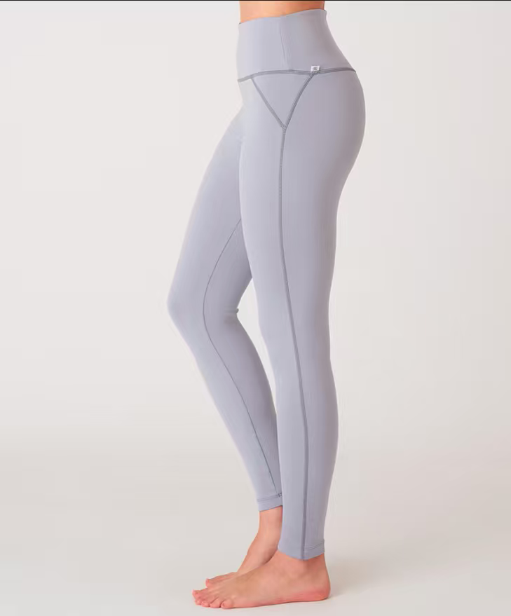 Multi-color blank fitness leggings flat lay bulk stock display, custom wholesale blank activewear